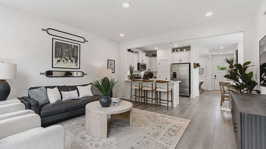 Tasteful family room with high ceilings, modern fixtures, and a warm, inviting feel of the Churchill Design