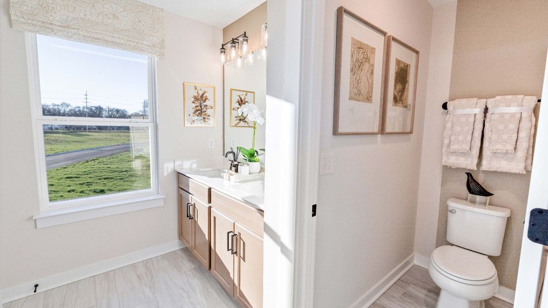 Dual Vanity with two sinks and dedicated water closet