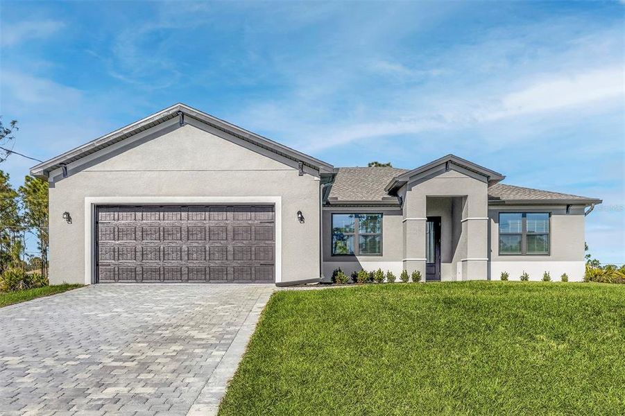 Front exterior of a new home in , Port Charlotte, FL, highlighting curb appeal (Image 14).