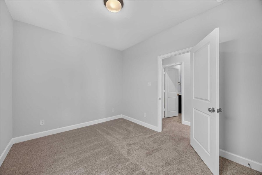 Room to Furnish – This bedroom's proportions comfortably fit a queen bed, two nightstands, and additional furniture — no tight squeeze required.