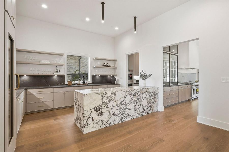 Another view of this multi-functional gathering area adjacent to the main kitchen with a rear entry to the chef's kitchen. Another view of this multi-functional gathering area adjacent to the main kitchen with a rear entry to the chef's kitchen.