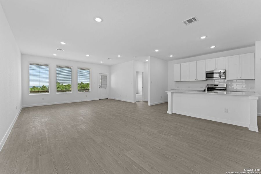 Spacious, unfurnished interior of a new home in Waterwheel: Coastline Collection, San Antonio (Image 14).