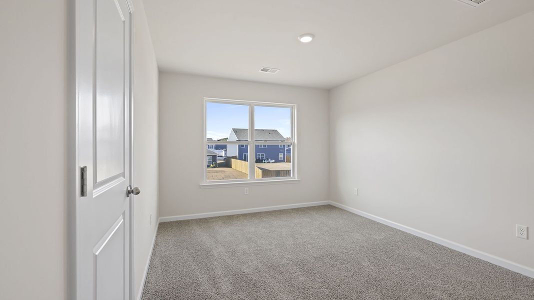 Spacious, unfurnished interior of a new home in Bentley Park, Greenwood (Image 22).