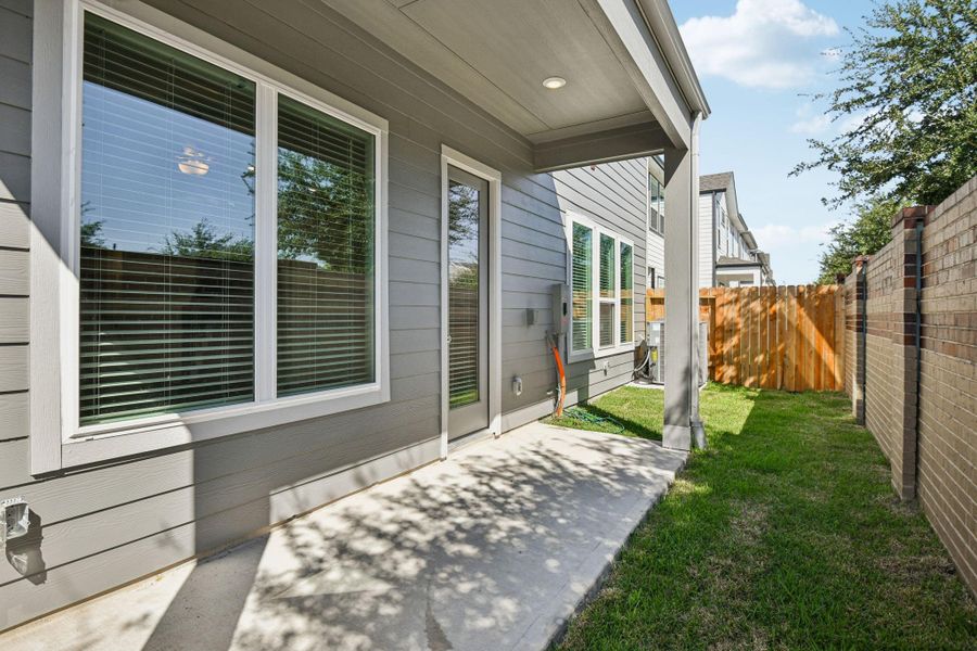 Exterior details and patio area of a home in Spring Brook Village - Luxe Series, Houston (Image 3). Exterior details and patio area of a home in Spring Brook Village - Luxe Series, Houston (Image 3).