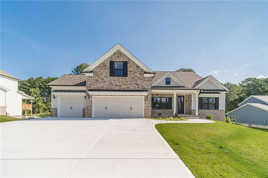 Front exterior of a new home in , Loganville, GA, highlighting curb appeal (Image 25).