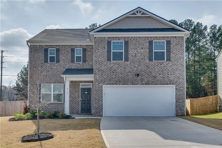 Front exterior of a new home in The Reserve at Calcutta, Stockbridge, GA, highlighting curb appeal (Image 2).