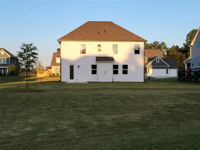 Front exterior of a new home in Wehunt Meadows, Hoschton, GA, highlighting curb appeal (Image 119).