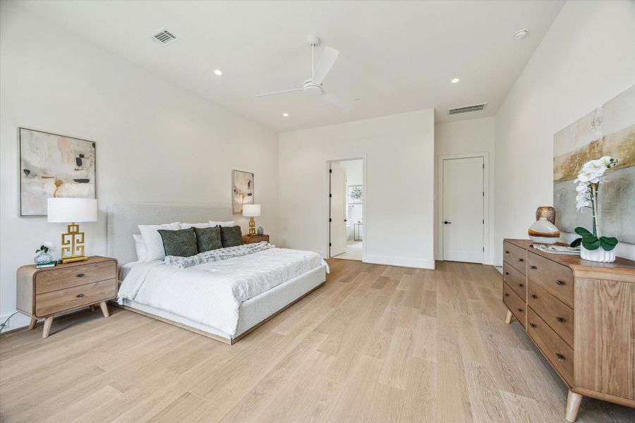Another view of the spacious primary suite with European white oak floors.