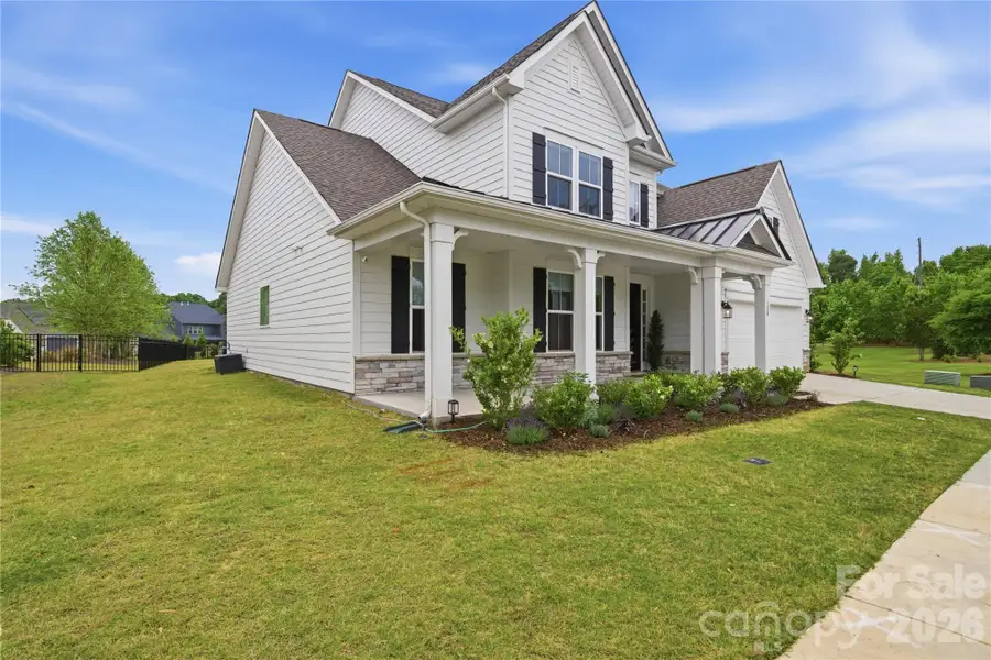 Front exterior of a new home in Massey, Fort Mill, SC, highlighting curb appeal (Image 24).