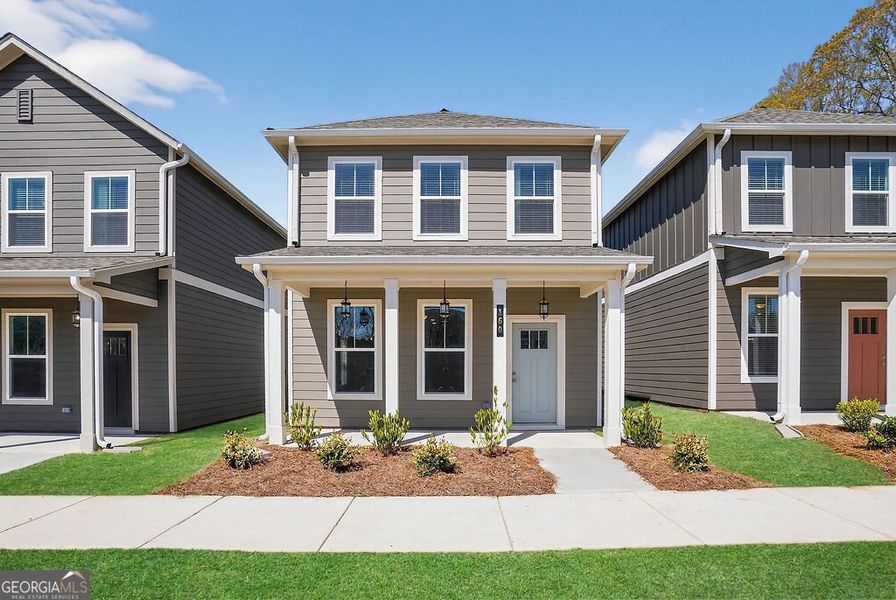 Front exterior of a new home in The Cottages at East Lanier, Fayetteville, GA, highlighting curb appeal (Image 1). Front exterior of a new home in The Cottages at East Lanier, Fayetteville, GA, highlighting curb appeal (Image 1).