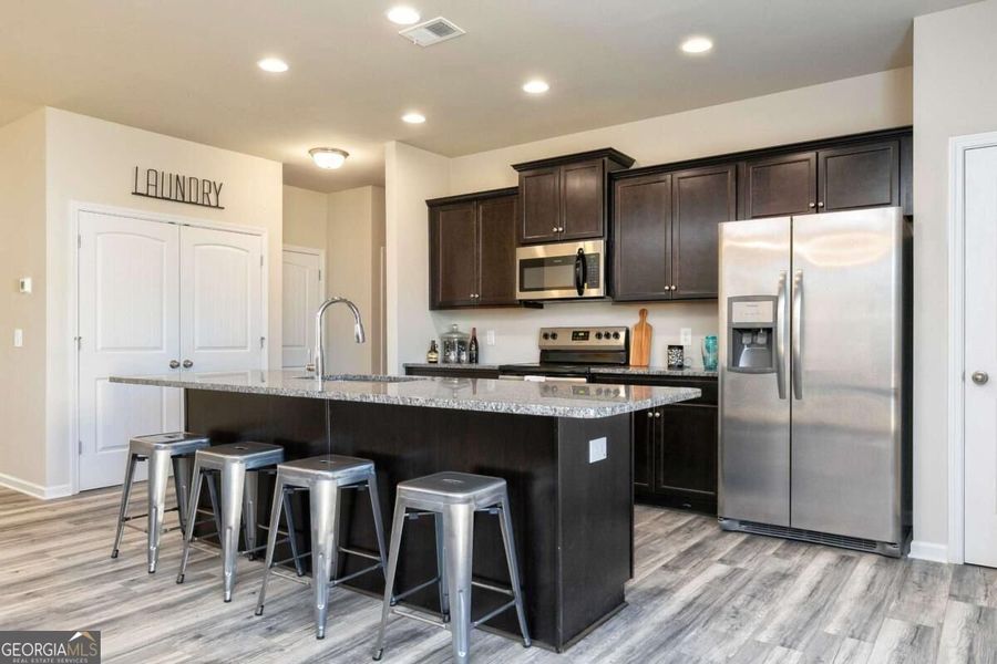 Furnished interior view inside a new home in Cobblestone Crossing Commons, Byron (Image 15).