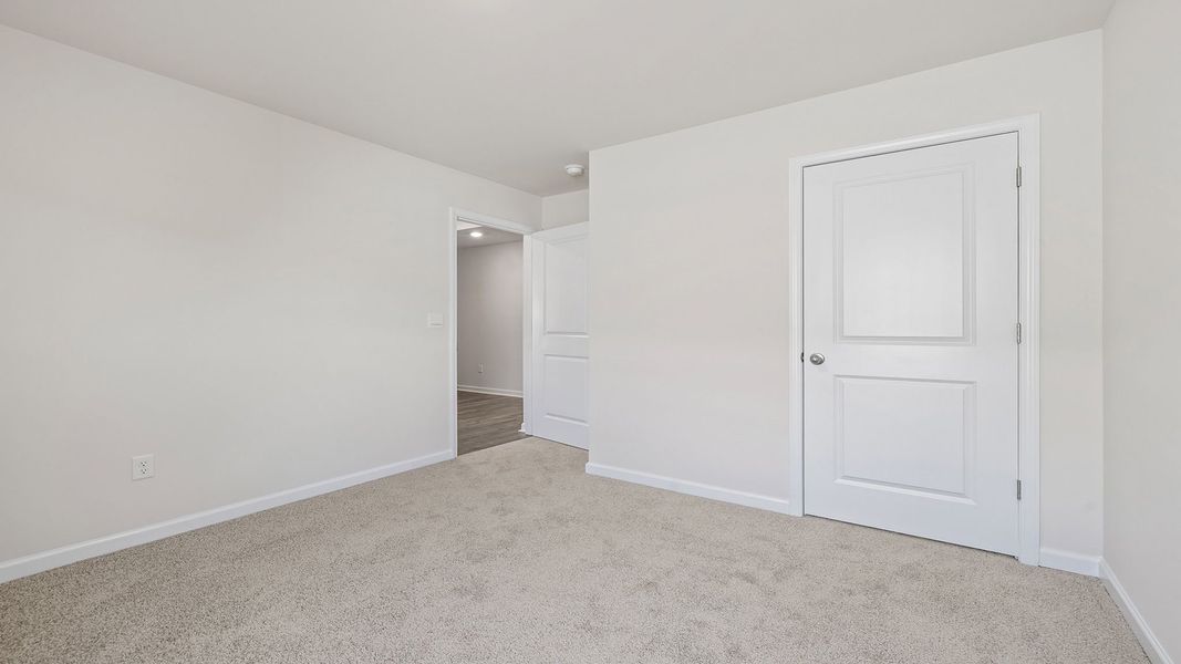 Spacious, unfurnished interior of a new home in Bentley Park, Greenwood (Image 22).