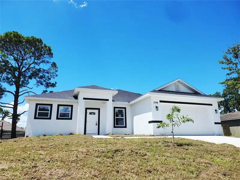 Front exterior of a new home in , Palm Bay, FL, highlighting curb appeal (Image 19). Front exterior of a new home in , Palm Bay, FL, highlighting curb appeal (Image 19).