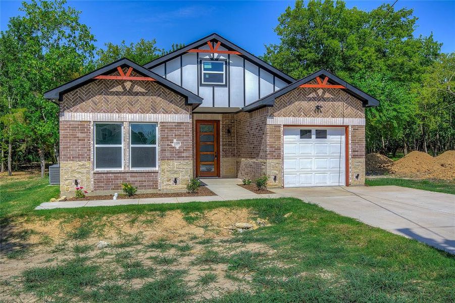 Front exterior of a new home in , Greenville, TX, highlighting curb appeal (Image 2). Front exterior of a new home in , Greenville, TX, highlighting curb appeal (Image 2).