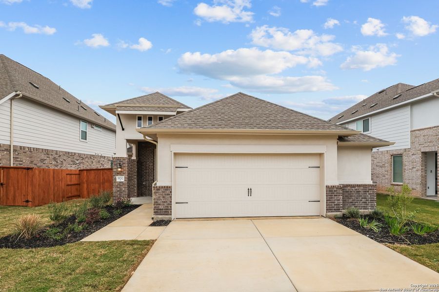Front exterior of a new home in Veramendi, New Braunfels, TX, highlighting curb appeal (Image 18).