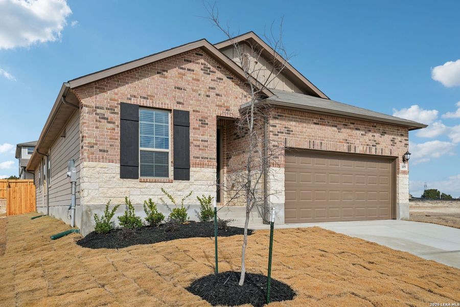 Front exterior of a new home in Legendary Trails - Premier Series, Cibolo, TX, highlighting curb appeal (Image 19).