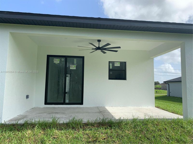 Front exterior of a new home in , Lehigh Acres, FL, highlighting curb appeal (Image 16).