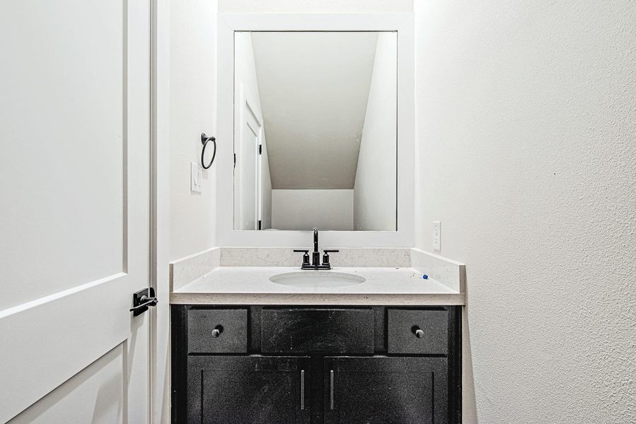 Stylish powder bath with modern vanity and fixtures Stylish powder bath with modern vanity and fixtures