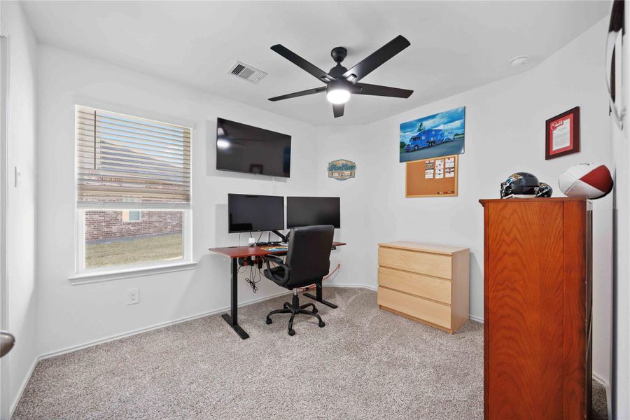 Third Bedroom / Dedicated Office:Ideal work-from-home space with ceiling fan, natural light, and room for a full desk setup. Can be used for fourth bedroom, office, playroom, or hobby room Third Bedroom / Dedicated Office:Ideal work-from-home space with ceiling fan, natural light, and room for a full desk setup. Can be used for fourth bedroom, office, playroom, or hobby room