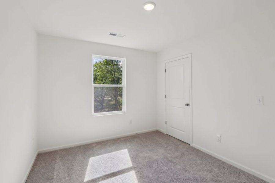 A room with a door and a window.