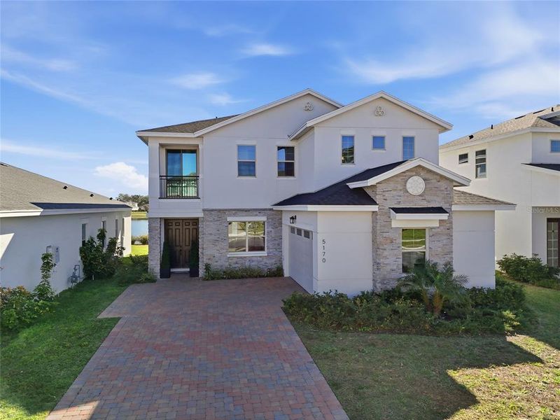 Front exterior of a new home in , St. Cloud, FL, highlighting curb appeal (Image 1). Front exterior of a new home in , St. Cloud, FL, highlighting curb appeal (Image 1).