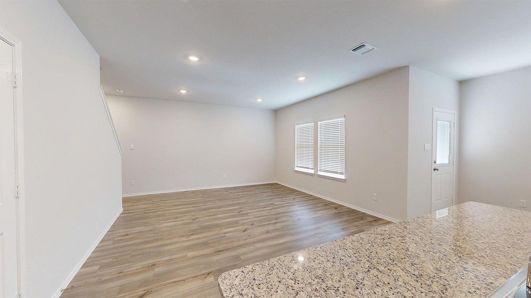 Spare room with light wood-type flooring and recessed lighting