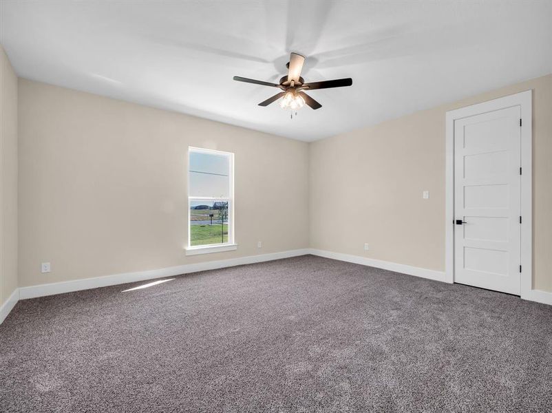 Unfurnished room with carpet flooring and ceiling fan