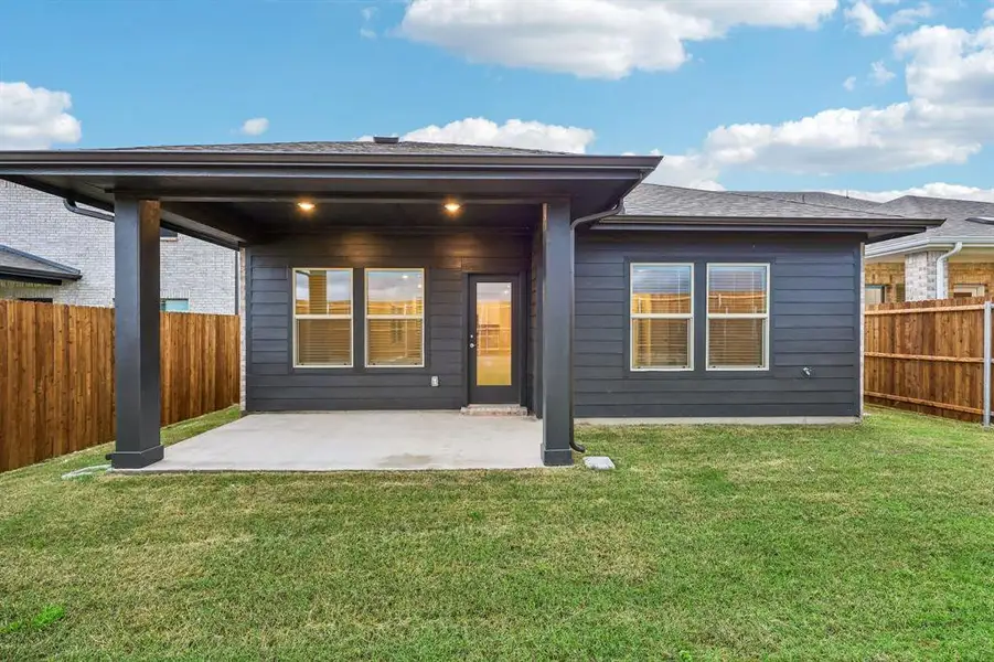 Exterior details and patio area of a home in Parks at Foster Crossing - Spring Series, Anna (Image 24).
