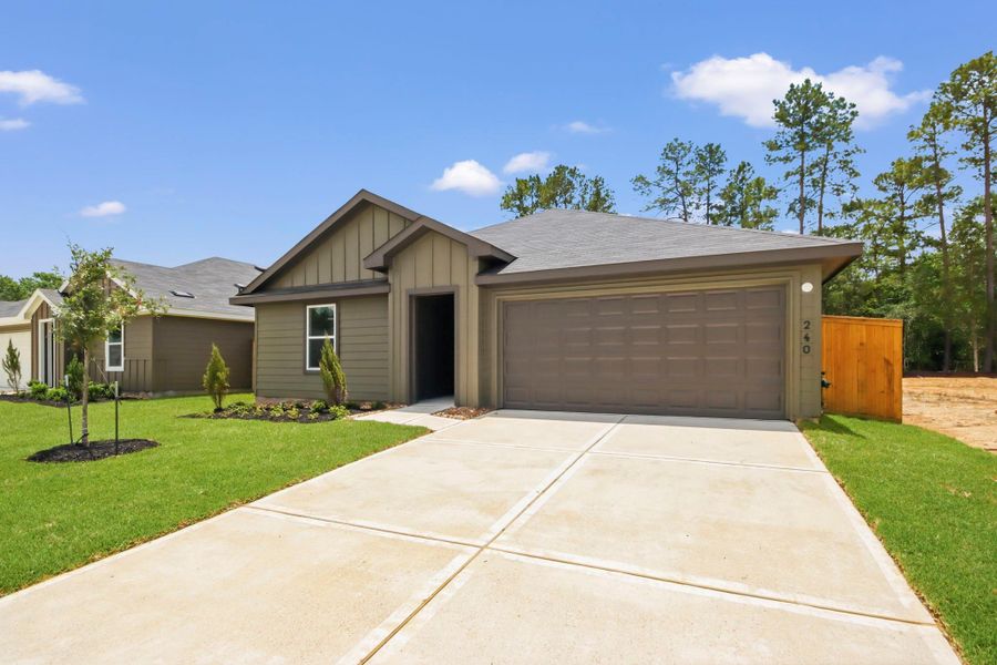 Front exterior of a new home in New Waverly Station, New Waverly, TX, highlighting curb appeal (Image 1). Front exterior of a new home in New Waverly Station, New Waverly, TX, highlighting curb appeal (Image 1).