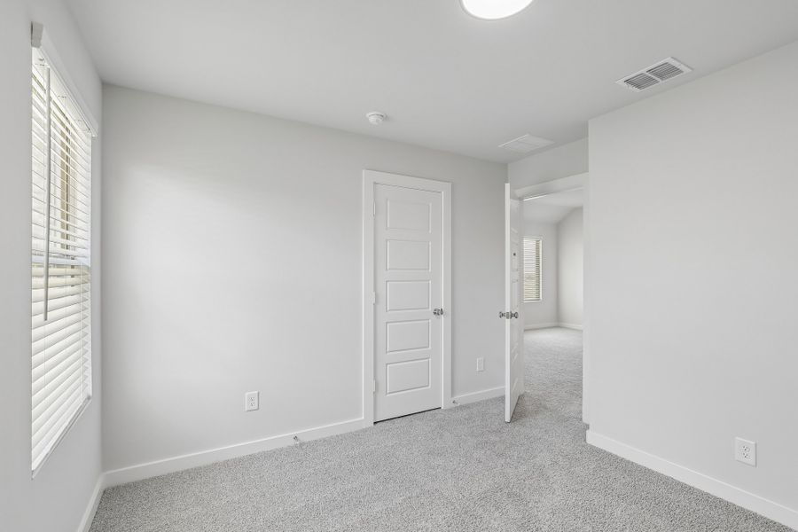 Bedroom in the Holden home plan by Trophy Signature Homes