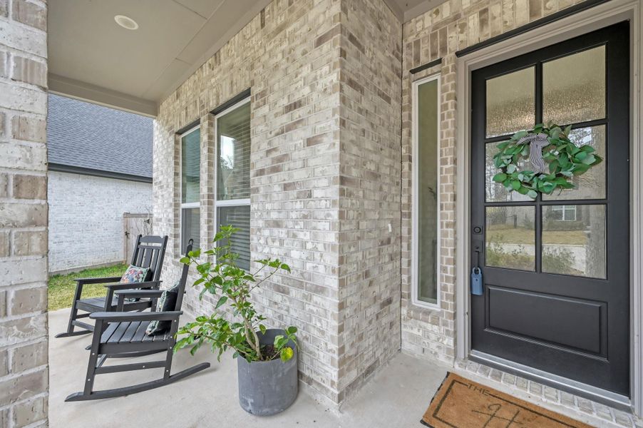 Relax and unwind on the cozy covered front porch.