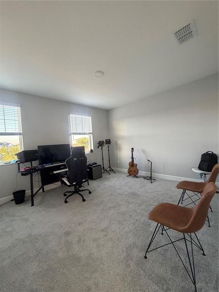 Furnished interior view inside a new home in Center Lake on the Park, St. Cloud (Image 9).