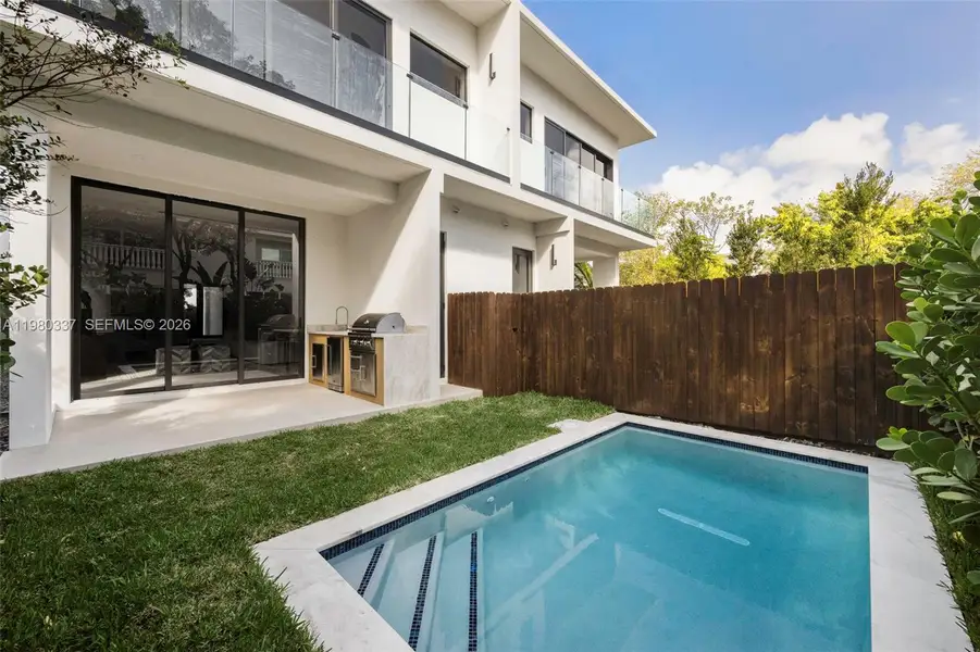 Exterior details and patio area of a home in , Miami (Image 3).