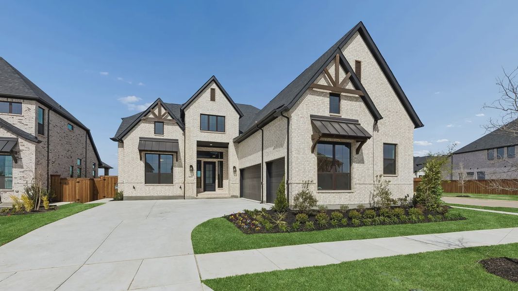 Representative exterior photo of a completed home built from the Winslow by Chesmar Homes in Lakes of Cane Island, Katy, TX (Image 2). Representative exterior photo of a completed home built from the Winslow by Chesmar Homes in Lakes of Cane Island, Katy, TX (Image 2).