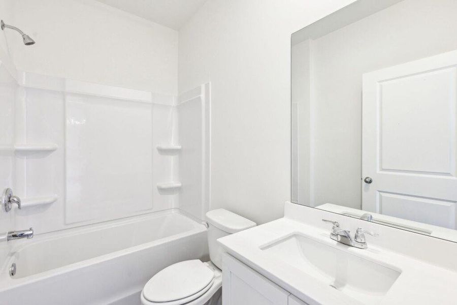 Furnished interior view inside a new home in Sunterra Lakes, Brookshire (Image 7).