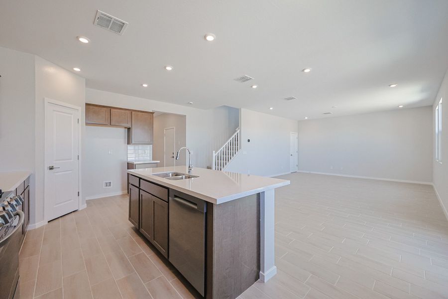 A kitchen with a marble island. A kitchen with a marble island.