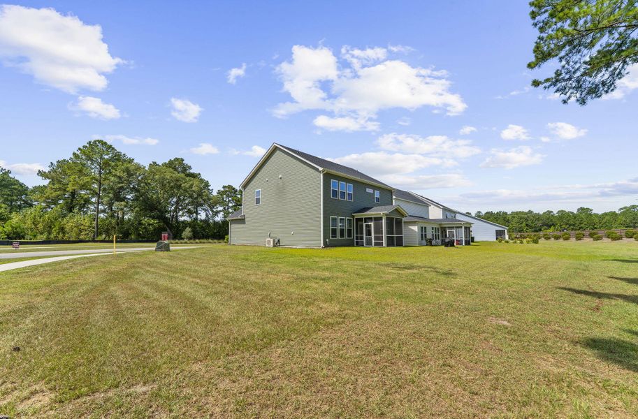 Exterior details and patio area of a home in The Groves of Berkeley, Moncks Corner (Image 30).