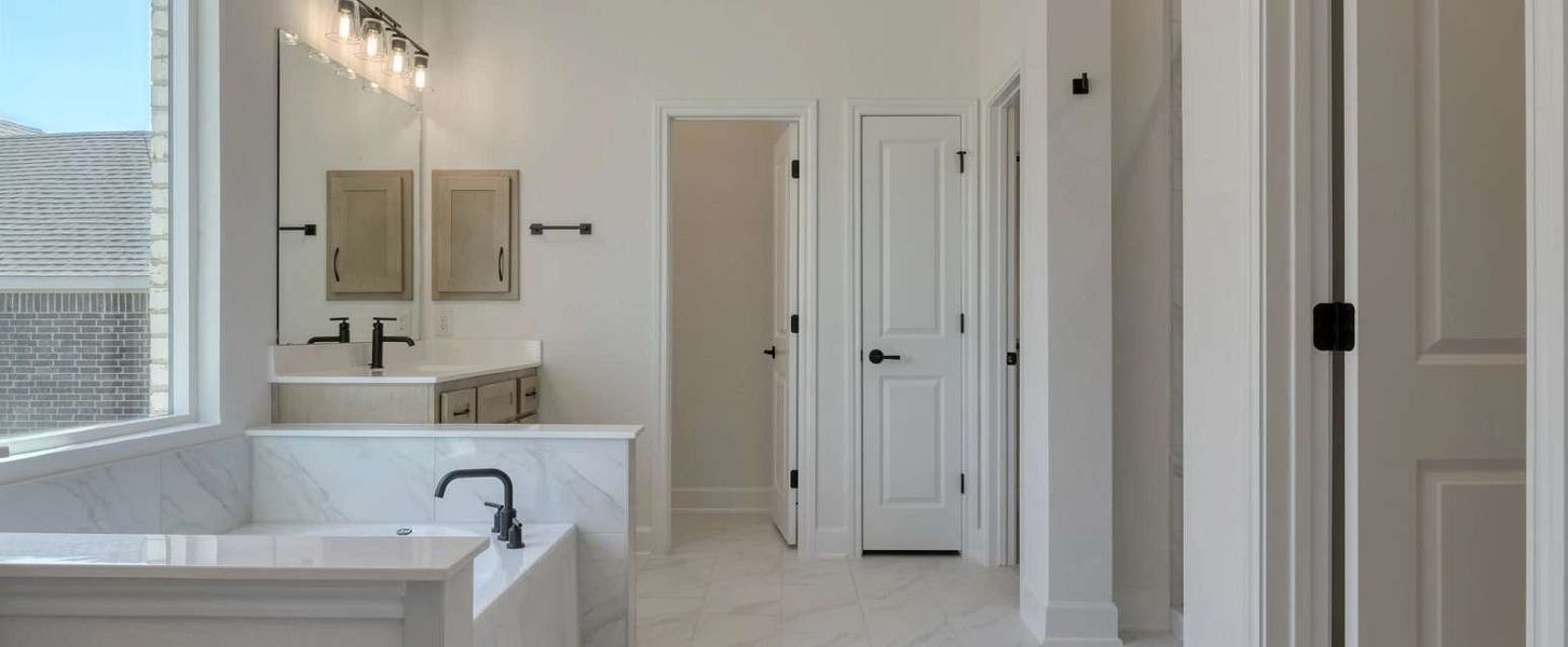 Representative furnished interior of a home built from the Alexander II by Ashton Woods in Sunday Creek at Kinder Ranch, San Antonio (Image 14).