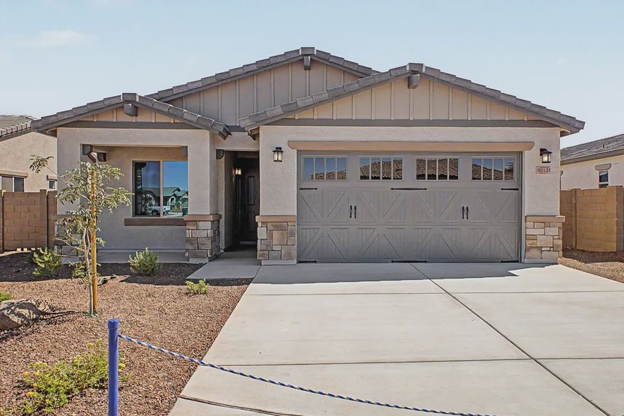Front exterior of a new home in Avanti at Granite Vista, Waddell, AZ, highlighting curb appeal (Image 23).