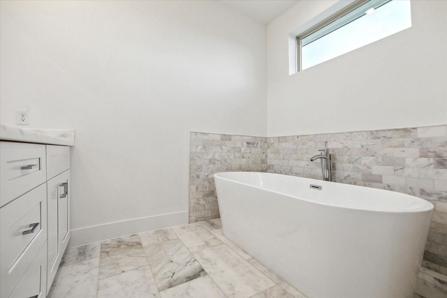 Primary Bathroom * Marble Everywhere! * Transom Window for EXTRA Natural Light.