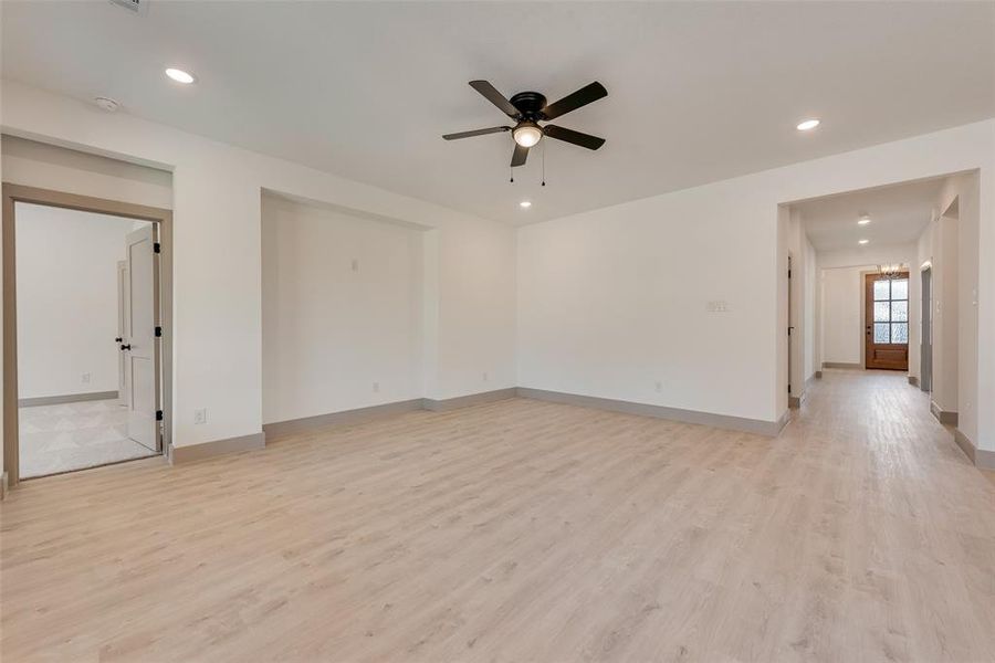 Empty room featuring light hardwood / wood-style flooring and ceiling fan