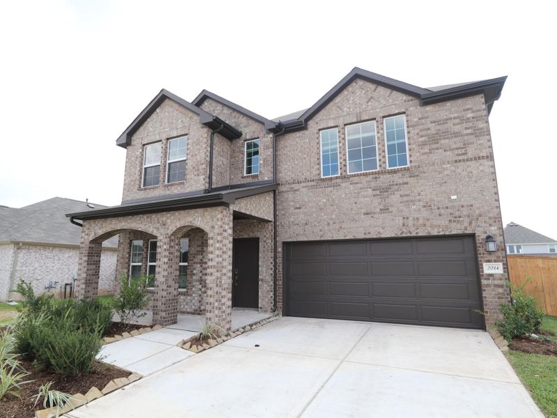 Front exterior of a new home in Miller's Pond, Rosenberg, TX, highlighting curb appeal (Image 22). Front exterior of a new home in Miller's Pond, Rosenberg, TX, highlighting curb appeal (Image 22).