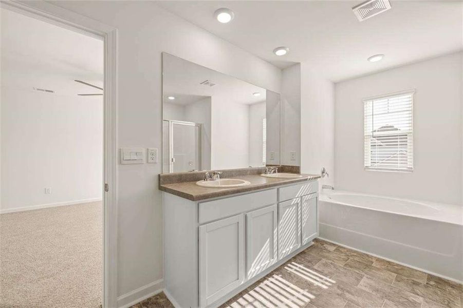 Furnished interior view inside a new home in Oakchase at Hampton, Hampton (Image 3).