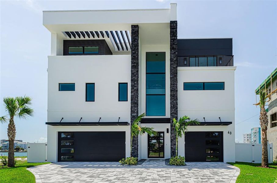 Front exterior of a new home in , Treasure Island, FL, highlighting curb appeal (Image 31).