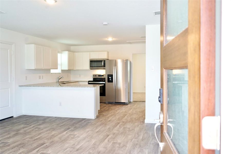 Furnished interior view inside a new home in , Conroe (Image 4).