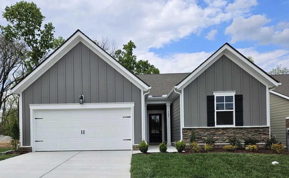 Front exterior of a new home in Cedars of Cane Ridge | 55+ Community, Antioch, TN, highlighting curb appeal (Image 1). Front exterior of a new home in Cedars of Cane Ridge | 55+ Community, Antioch, TN, highlighting curb appeal (Image 1).