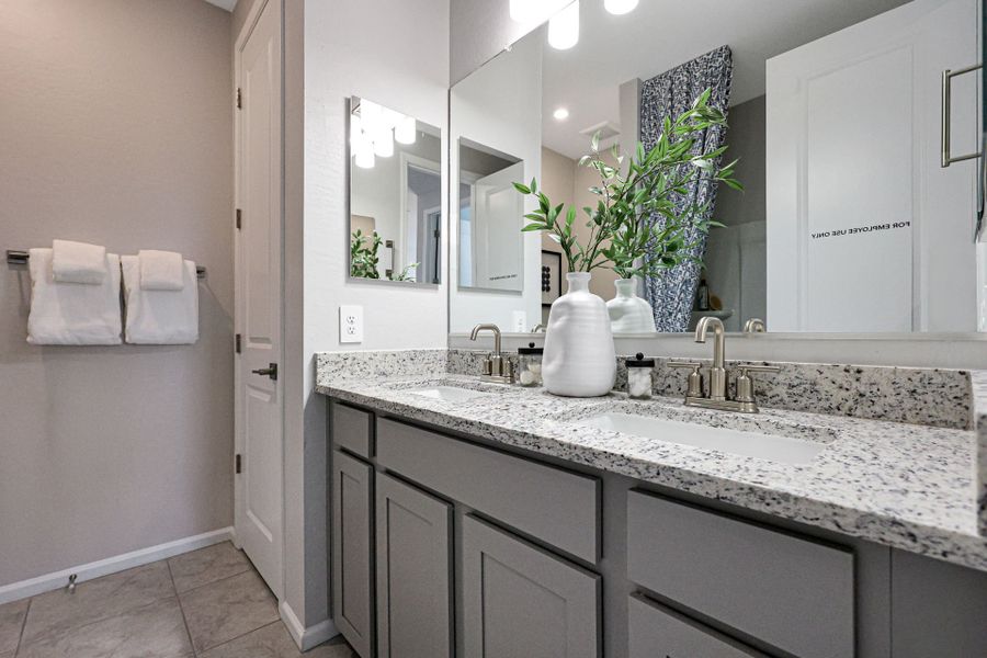 A bathroom with a large mirror.