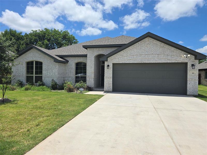Front exterior of a new home in Trail Creek, Cleburne, TX, highlighting curb appeal (Image 1). Front exterior of a new home in Trail Creek, Cleburne, TX, highlighting curb appeal (Image 1).