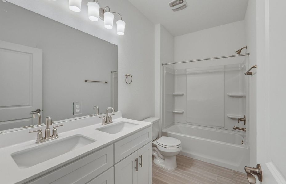 Furnished interior view inside a new home in Crosswinds, Kyle (Image 9).