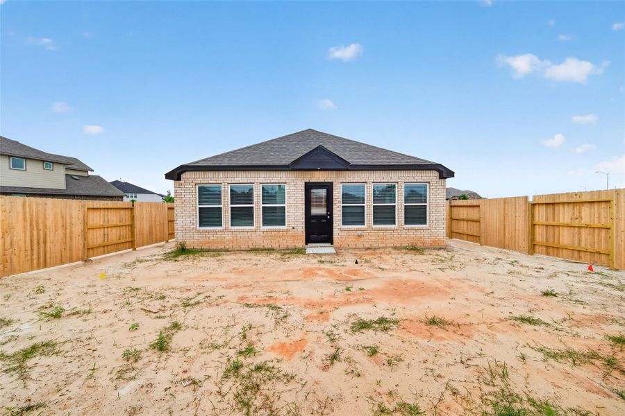 Exterior details and patio area of a home in Sunterra, Katy (Image 30).